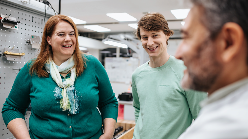 Colleagues discussing in production